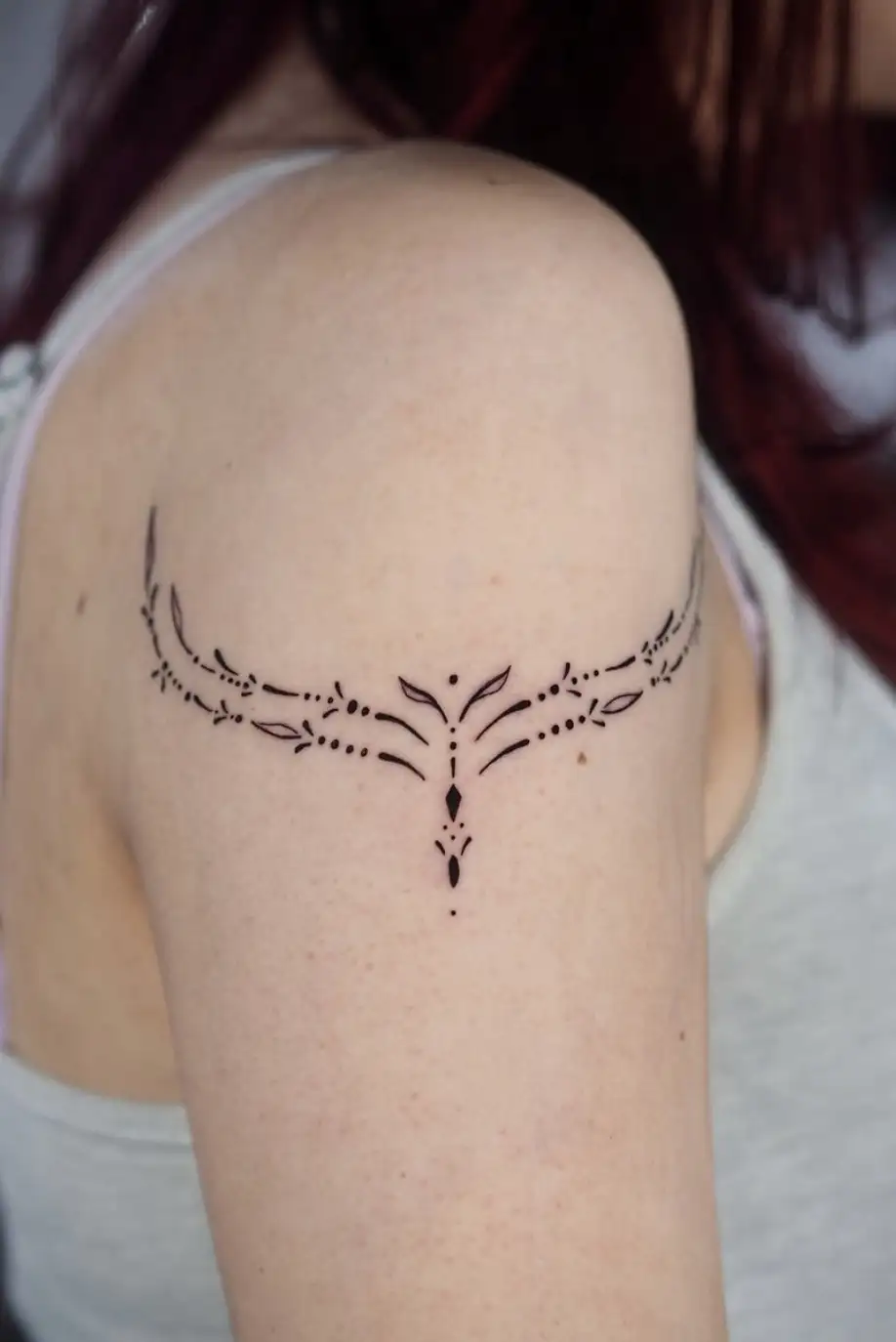 Minimalist ornamental tattoo with delicate line patterns by Ayah at Omnia Tattoo Melbourne